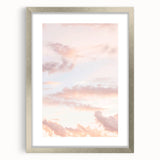 Textured abstract art print in cool blue and silver hues, framed in matte silver, ideal for modern bedroom ambiance.