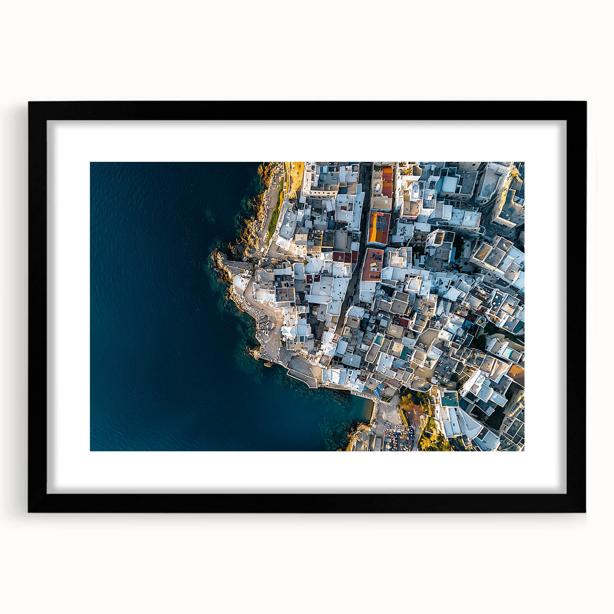 Framed landscape artwork depicting dramatic cliffs with a black mat border, showcasing intricate details and rich colors, perfect for home decor and inspiration.