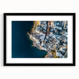 Framed landscape artwork depicting dramatic cliffs with a black mat border, showcasing intricate details and rich colors, perfect for home decor and inspiration.