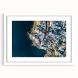 Framed landscape artwork showcasing majestic cliffs against a serene sky, presented in a sleek white mat for an elegant finish, perfect for home decor.