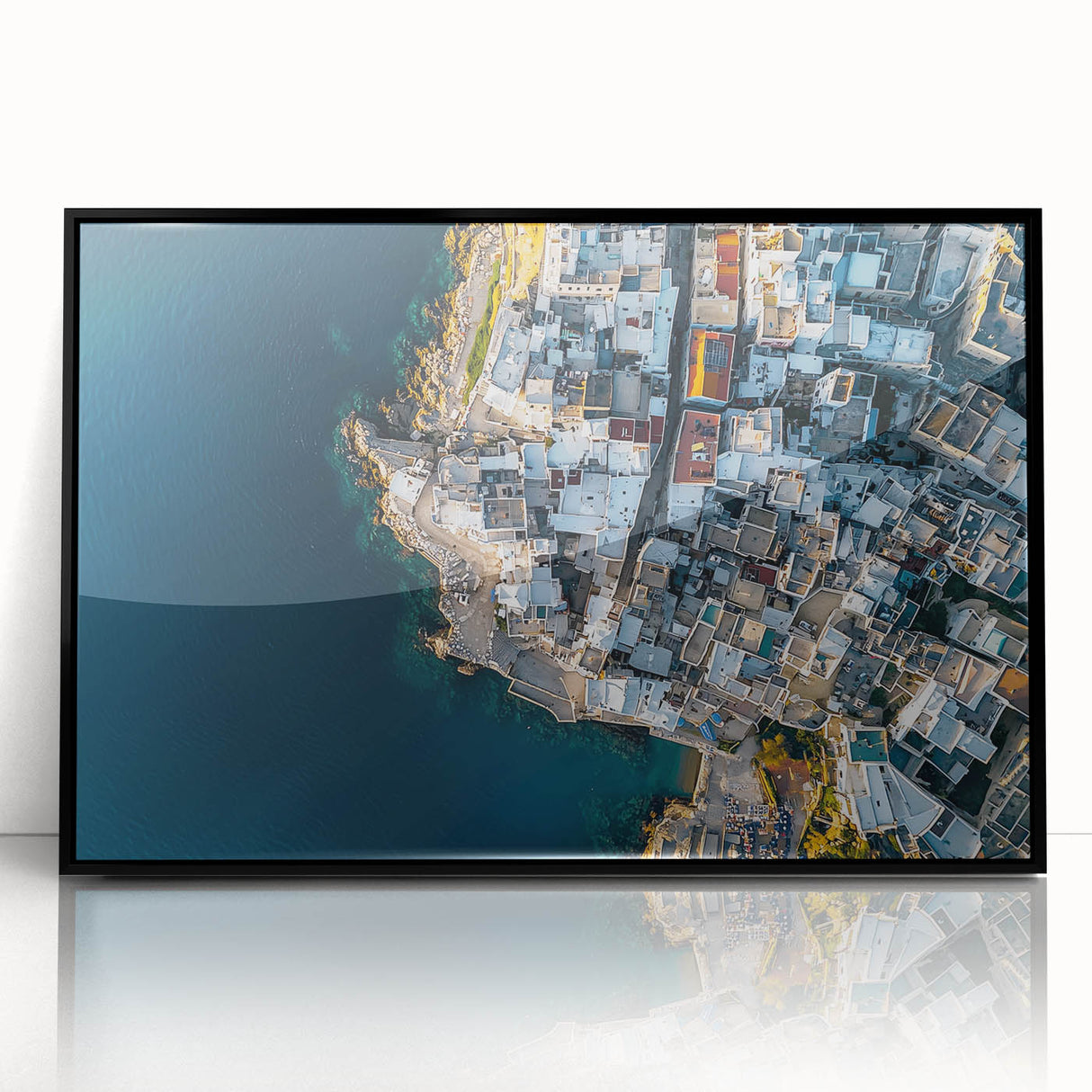 Framed acrylic artwork showcasing a dramatic cliff landscape with vibrant colors and intricate details, presented in a sleek black frame for an elegant display.