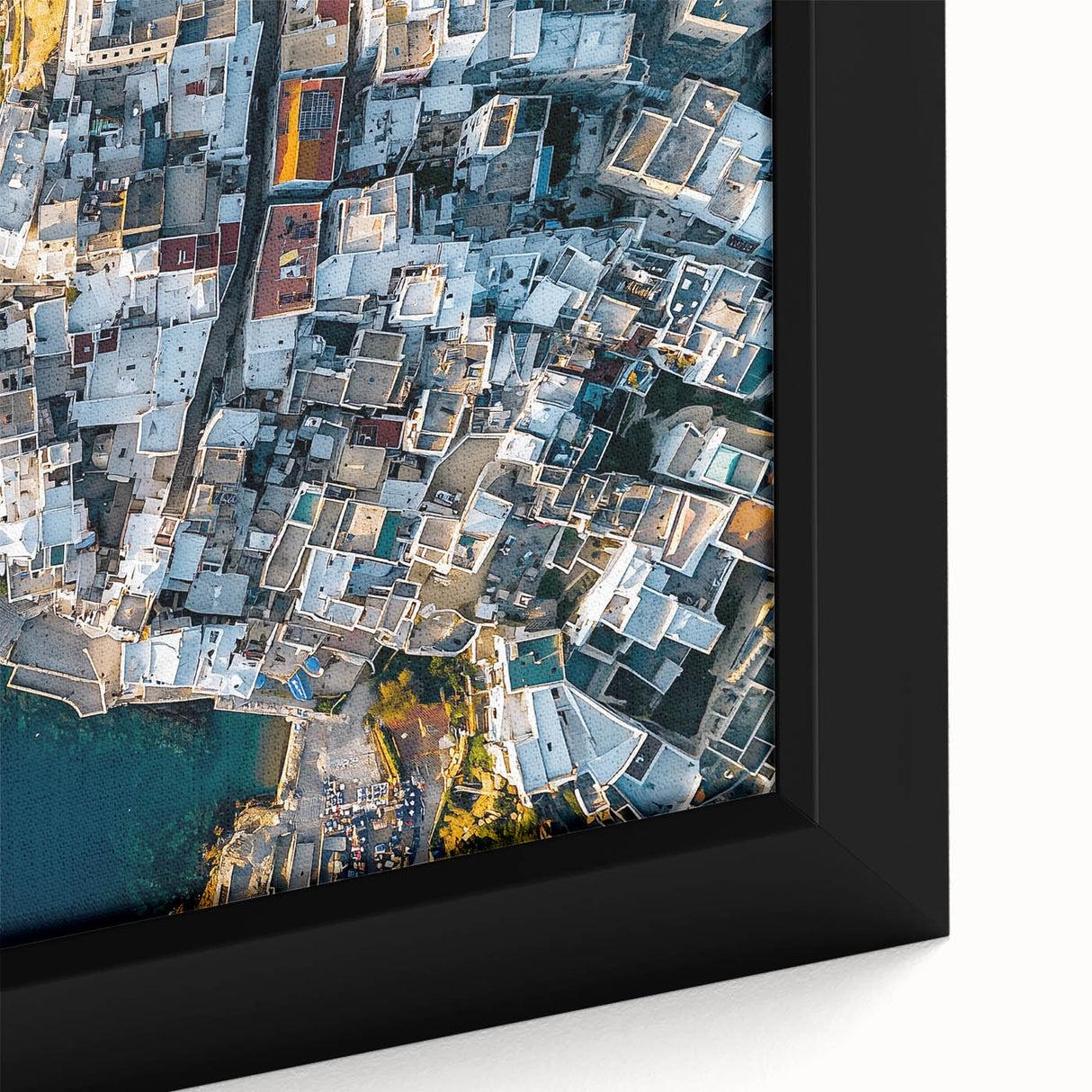 Close-up view of a framed canvas print depicting a vibrant landscape with dramatic cliffs, showcasing rich colors and intricate textures, perfect for home decor.