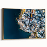 Framed canvas artwork depicting a vibrant landscape with dramatic cliffs, featuring a gold frame that enhances the visual appeal, perfect for home decor.