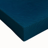 Close-up of a stretched canvas artwork depicting dramatic cliffs and serene landscapes, showcasing vibrant colors and intricate textures suitable for home decor.