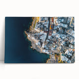 Stretched canvas artwork depicting a stunning landscape of rugged cliffs under a clear blue sky, showcasing vibrant colors and natural textures, ideal for home decor.