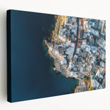 Stretched canvas artwork depicting dramatic cliffs against a vibrant sunset, showcasing rich colors and detailed textures, perfect for enhancing home decor.