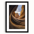 Framed landscape art print showcasing vibrant canyons in rich earth tones, set in a sleek black frame with a white mat, perfect for modern home decor.