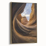 Framed canvas art showcasing a stunning landscape of canyons in rich earthy tones, highlighted by a luxurious gold frame, perfect for modern home decor.