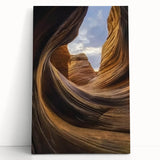 Stretched canvas artwork showcasing a vibrant landscape of canyons with rich earth tones and dramatic shadows, perfect for enhancing home decor or art collections.