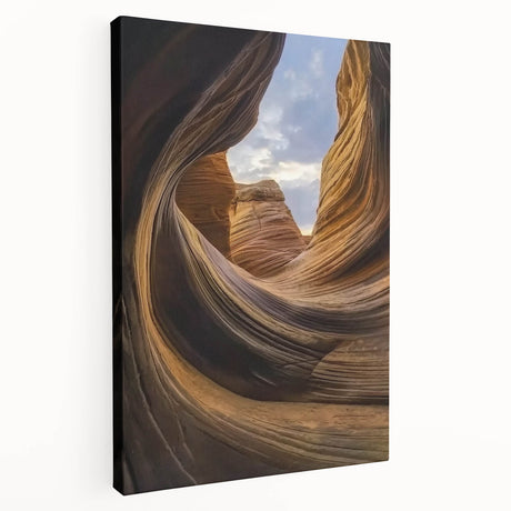 Stretched canvas artwork depicting a vibrant landscape of canyons, showcasing rich earth tones and dramatic rock formations, perfect for home decor.