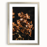 Textured abstract art print in warm autumn hues on a silver framed canvas, suited for bedroom wall decor.