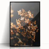 Large abstract wall art depicting autumnal trees in warm orange and red tones, framed in black acrylic.