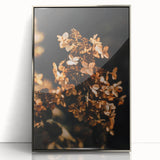 Mid-century modernist art depicting autumnal trees in burnt orange and red tones on a silver-framed acrylic print.