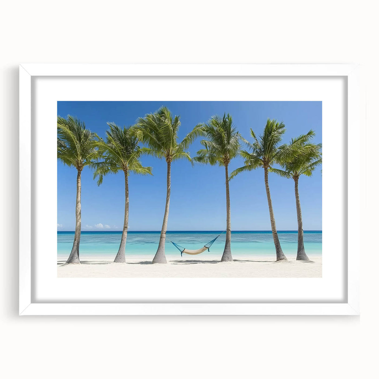 Landscape artwork framed in white mat, depicting serene beach scene with soft waves and golden sand, perfect for coastal home decor.