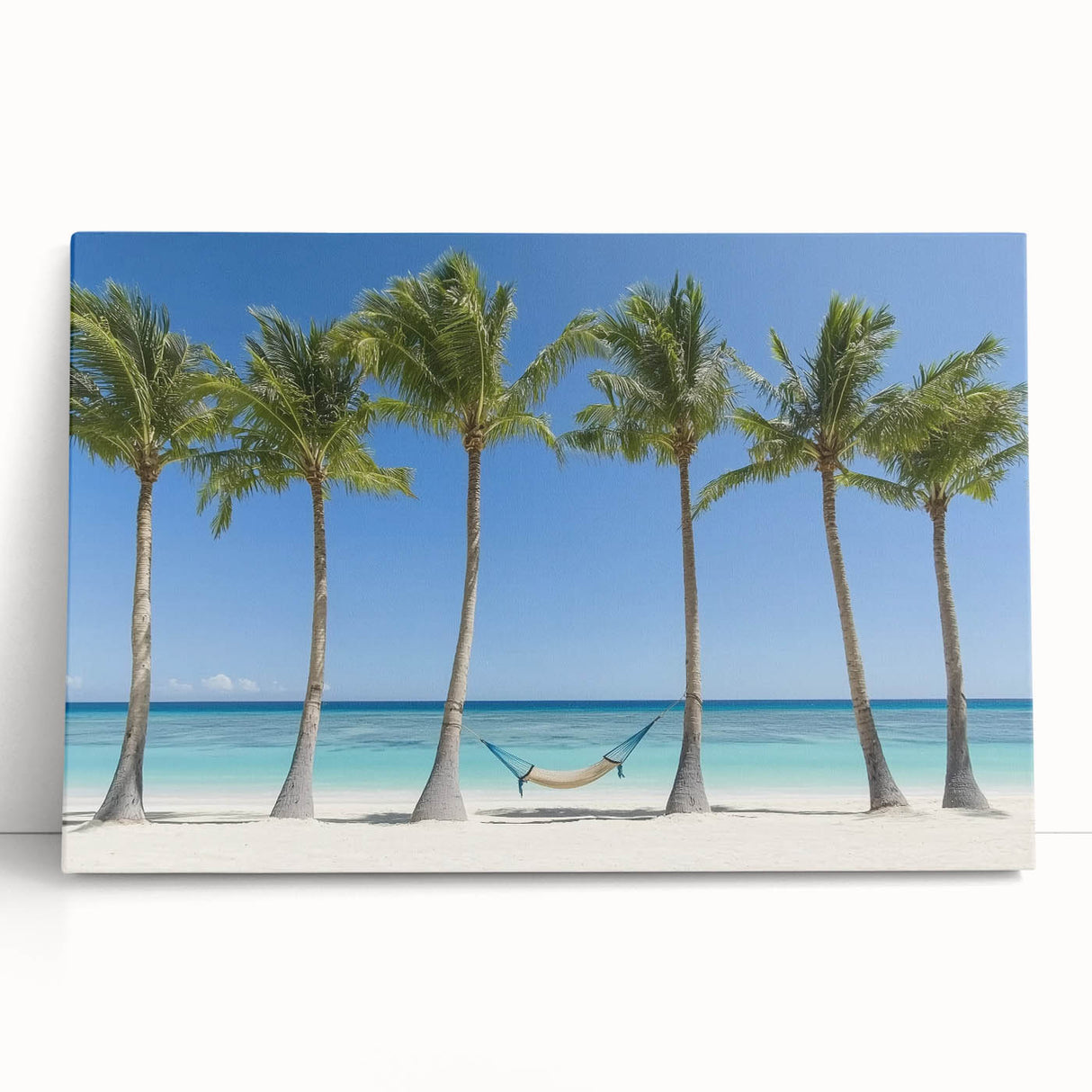 Stretched canvas art featuring a serene beach landscape with vibrant colors, perfect for coastal decor, leaning against a neutral wall, creating a calming atmosphere.