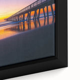 Close-up of a framed landscape canvas artwork depicting a serene bridge scene, featuring lush greenery and a tranquil river, ideal for home decor.