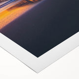 Rolled canvas showcasing a vibrant landscape bridge design, featuring rich colors and intricate details, securely packaged in a durable cardboard tube for safe transport.