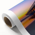 Rolled canvas showcasing a vibrant landscape bridge design, featuring rich colors and intricate details, securely packaged in a durable cardboard tube for safe shipping.