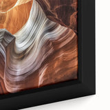 Close-up of a framed canvas artwork depicting stunning canyons in a vibrant landscape, showcasing rich colors and intricate textures, perfect for home decor.