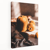 Side view of a large stretched canvas featuring a minimalist fall tree design in muted orange and brown tones.