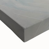 Close-up of a stretched canvas showcasing an abstract geometric design with vibrant colors, perfect for modern home decor. Ideal for adding a contemporary touch to any living space.