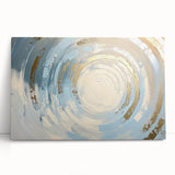Abstract geometric stretched canvas art featuring vibrant colors and dynamic shapes, leaning against a neutral wall, perfect for modern home decor.