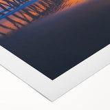 Rolled canvas showcasing a vibrant landscape bridge design with rich colors and intricate details, packaged securely in a cardboard tube for easy transport.