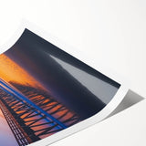 Rolled print showcasing a landscape bridge design, featuring vibrant colors and intricate details, securely packaged in a protective cardboard tube for safe delivery.