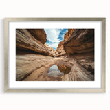 Framed landscape artwork depicting vibrant canyons in rich hues of red and orange, enhanced by a sleek silver mat, perfect for home decor and art enthusiasts.