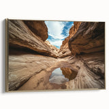 Framed canvas artwork showcasing a stunning landscape of canyons, with a gold frame accentuating the vibrant colors and intricate details, perfect for home decor.