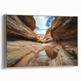 Framed landscape canvas featuring a stunning view of canyons, enhanced with a silver frame, perfect for home decor. Ideal for nature enthusiasts and art lovers.