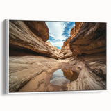Framed canvas artwork showcasing a stunning landscape of canyons with vivid colors and intricate details, displayed from a side view against a white background. The piece adds a touch of nature-inspired elegance to any room decor, perfect for art enthusiasts.