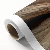 Stunning landscape canvas print showcasing majestic canyons in warm earth tones, expertly rolled and ready for display in home or office decor.