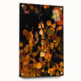 Large abstract wall art depicting fall scenes in muted orange and brown tones on acrylic glass.