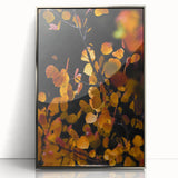 Mid-century modernist art of an abstract fall scene in orange and brown hues on a silver-framed acrylic print.