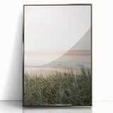 Mid-century modernist art featuring geometric shapes in pastel colors on a silver-framed acrylic print.