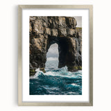 Framed landscape artwork showcasing dramatic cliffs in silver tones, featuring a white mat for enhanced presentation, ideal for modern home decor.
