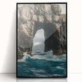 Framed acrylic artwork depicting a dramatic landscape with towering cliffs and vibrant colors, set against a black frame, ideal for modern home decor.