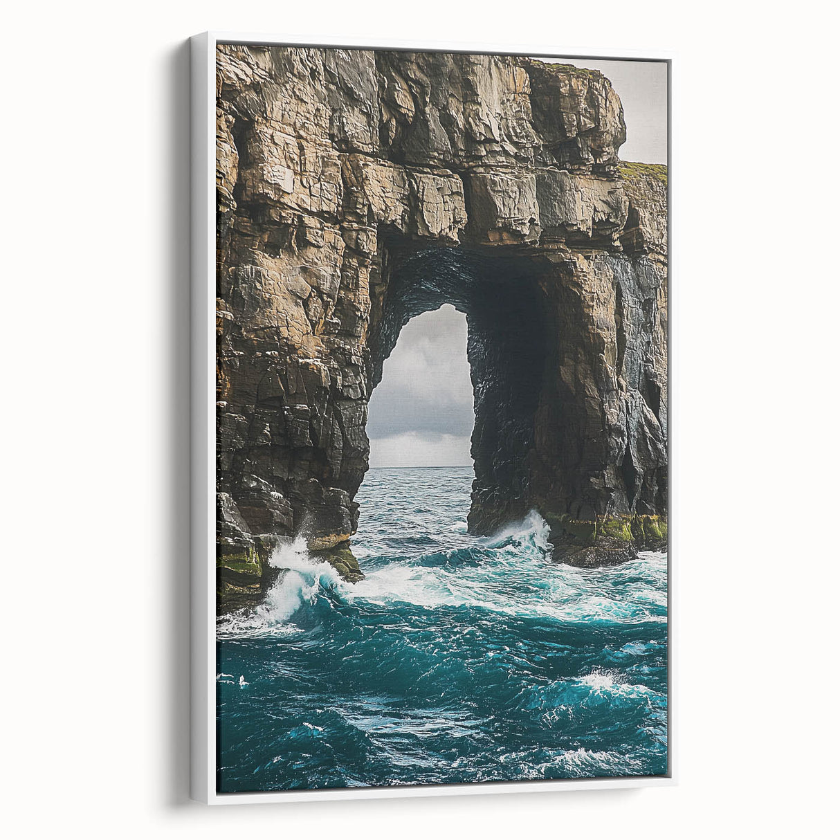 Framed canvas artwork showcasing a stunning coastal landscape with dramatic cliffs and vibrant colors, presented in a sleek white frame, ideal for home decor.