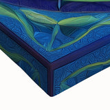 Close-up of a vibrant abstract geometric design on stretched canvas, showcasing bold colors and intricate patterns, perfect for modern home decor.