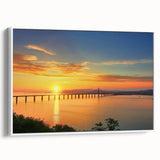 Framed canvas artwork depicting a serene landscape with a bridge, set against a white background, perfect for home decor and enhancing living spaces.