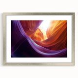 Silver-framed landscape art print showcasing vibrant canyons, complete with a white mat for an elegant finish, perfect for home decor and nature enthusiasts.
