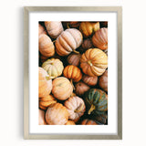 Textured art depicting abstract autumnal colors in muted orange and brown on a framed silver canvas.