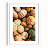 Abstract art print featuring swirling autumnal colors in red and orange on a white framed canvas.