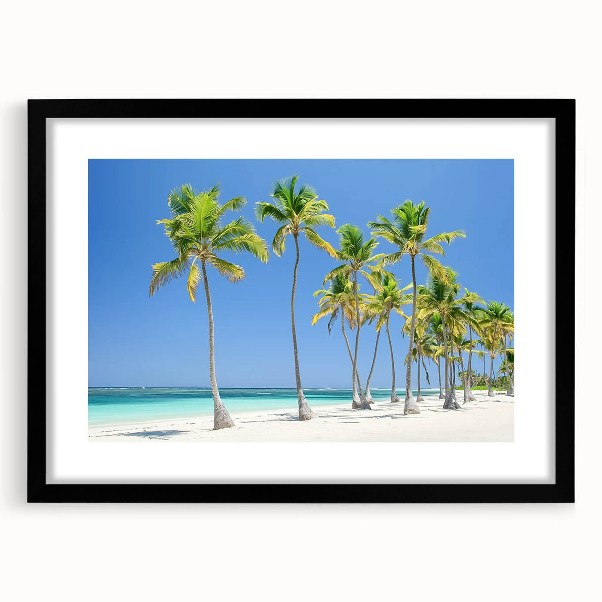 Black-framed landscape artwork depicting a serene beach scene, featuring soft waves and golden sand, designed to enhance interior decor and evoke tranquility.
