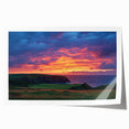 Stunning landscape print of dramatic cliffs against a vibrant sunset, rolled for easy shipping, showcasing rich colors and intricate details for home decor.