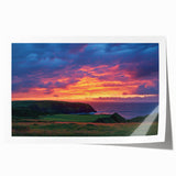 Stunning landscape print of dramatic cliffs against a vibrant sunset, rolled for easy shipping, showcasing rich colors and intricate details for home decor.
