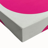 Close-up of a vibrant geometric abstract stretched canvas artwork, showcasing intricate patterns in bold colors like blue, yellow, and red, ideal for modern decor.