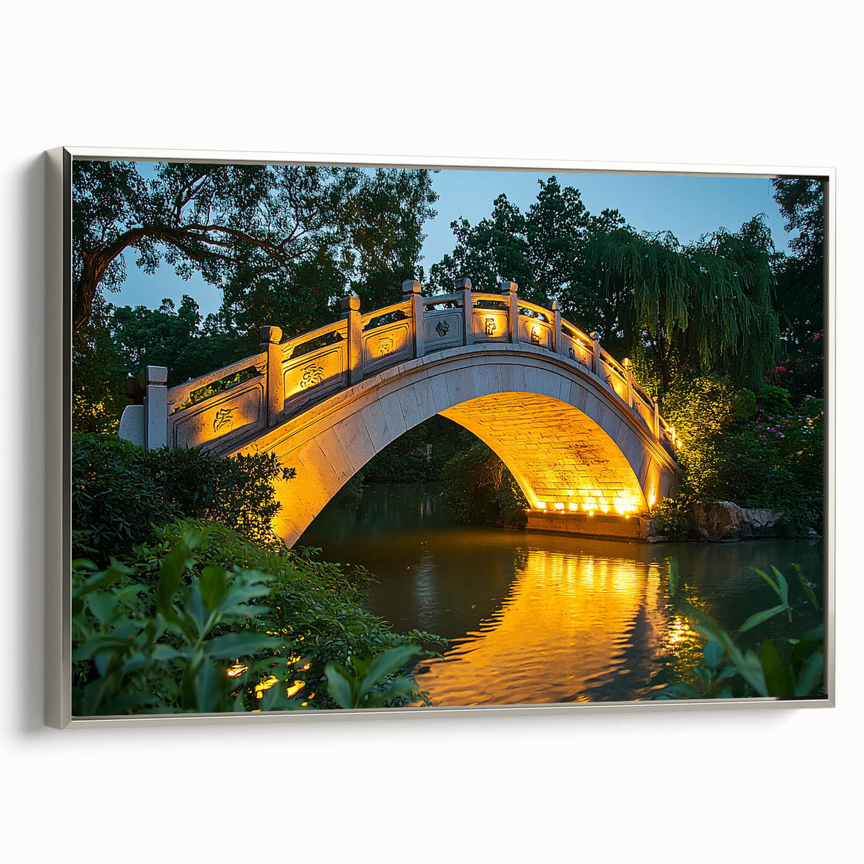 Framed canvas artwork depicting a serene landscape bridge scene, showcasing vibrant colors and intricate details, elegantly displayed with a silver frame.