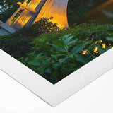 Landscape canvas print depicting a serene bridge scene with lush greenery and a clear blue sky, rolled and ready for display, ideal for home decor.